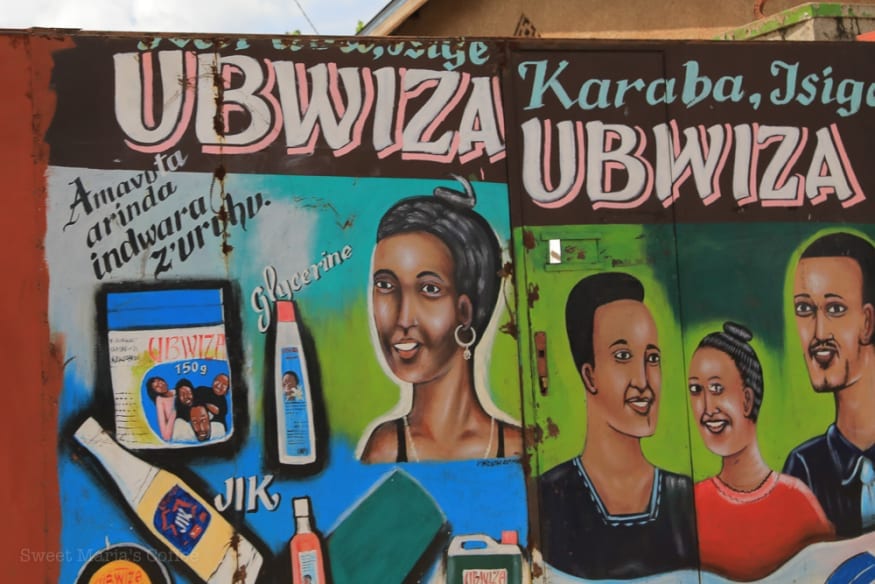 Hand-painted hair product signs in Burundi during a visit to green coffee sites