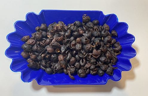 Dried cascara coffee fruit tea laid out in a tray.