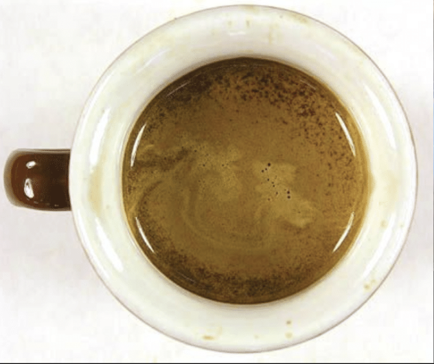 espresso shot crema from above in a demitasse
