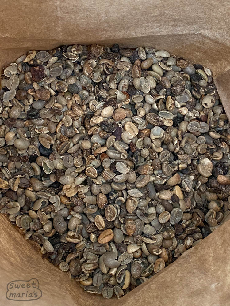Low grade coffee has many different designations, from Triage grade to mixed home process coffee. The lowest grade is currently sold for 80 cents per pound. A big buyer is India I am told, for coffee sold by street vendors (where this lot was going at least).