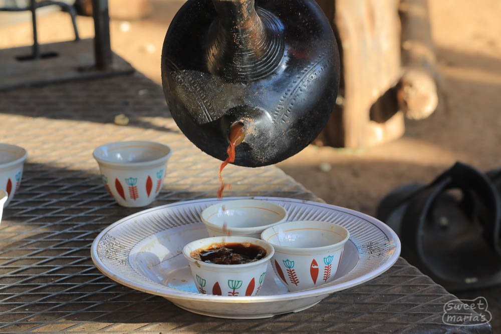 This is a woman pouring coffee from a jebena. They serve coffee at many farm and coop stops in Ethiopia, which is great unless it is 5 pm or later.