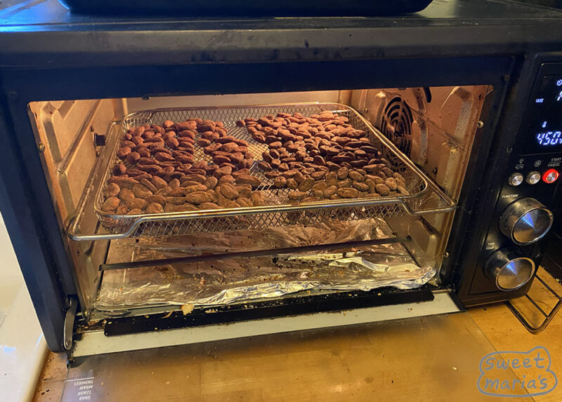 Roasting cacao at home in a convection toaster oven on a screen with high air flow fan setting
