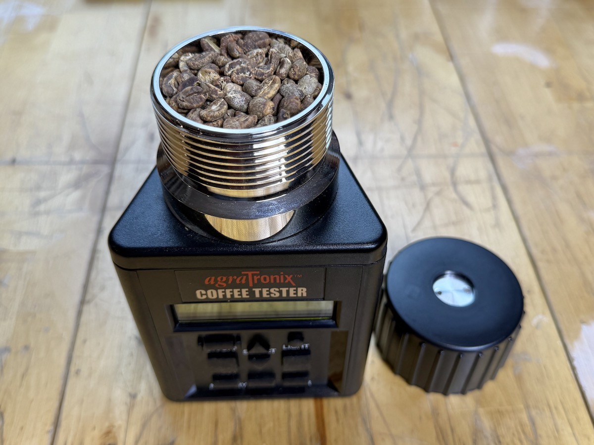 Testing water content level of the Aged coffee using an AgraTronix moisture meter.